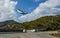 St. Barth Commuter plane landing at Remy de Haenen Airport also known as Saint Barthelemy Airport