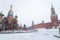 St Basil Temple and Spasskaya Tower of Kremlin during snowstorm