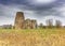 St Benet`s Abbey gatehouse and mill on the Norfolk Broads during a winter storm.