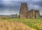 St Benet`s Abbey gatehouse and mill on the Norfolk Broads during a winter storm.