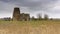 St Benet`s Abbey gatehouse and mill on the Norfolk Broads during a winter storm