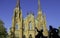 St. Dunstan`s Basilica Cathedral and the bronze statue of two Fathers of Confederation in the sunny day in Charlottetown