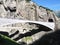 St. Gotthard and Teufelsbruecke, alpine Devil`s road bridge and tunnel over Reuss river near Andermatt town, Switzerland