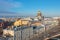 St. Isaac`s Cathedral in the distance above the rooftops of the city of Saint-Petersburg, a view from the heights of the Moika