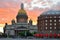 St. Isaac\'s Cathedral and hotel Astoria under the crimson sunset