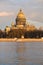 St. Isaac\'s Cathedral in the rays of the setting sun. View from the Admiralty embankment. Saint Petersburg