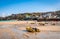 St Ives, Cornwall, England. The beach with boats at low tide, with the town in the background.