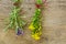 St. John\'s wort and lavender hanging to dry in front of rustic