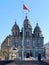 St. Joseph`s Church, Catholic church in Beijing. Romanesque Revival style in architecture. Red China flag in front of the facade.