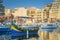 St.Julian`s, Malta - Colorful Luzzu fishing boats at Spinola bay