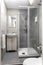 St Julians, Malta - April 28th 2020: Small ensuite bathroom with grey and beige tile