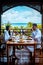 St Lucia caribbean, couple on vacation at Saint Lucia, men and woman in luxury resort during lunch with a look at the