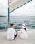 St Lucia, couple men and woman watching sunset from sailing boat in the Caribbean sea near Saint Lucia or St Lucia