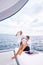 St Lucia, couple men and woman watching sunset from sailing boat in the Caribbean sea near Saint Lucia or St Lucia