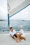 St Lucia, couple men and woman watching sunset from sailing boat in the Caribbean sea near Saint Lucia or St Lucia