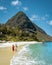 St Lucia , couple walking on the beach during summer vacation on a sunny day at Sugar beach, men and woman on vacation