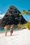 St Lucia , couple walking on the beach during summer vacation on a sunny day at Sugar beach, men and woman on vacation