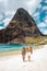 St Lucia , couple walking on the beach during summer vacation on a sunny day at Sugar beach, men and woman on vacation