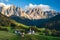 St Magdalena church in Val di Funes valley, Dolomites, Italy. Furchetta and Sass Rigais mountain peaks in background