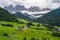 St Magdalena church in Val di Funes valley, Dolomites, Italy. Furchetta and Sass Rigais mountain peaks in background