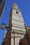 St Magnus the Martyr Church in the financial district of the City of London with a clock on the left side and the Monument to the