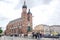 St. Mary`s Basilica with horse carriage riding serving tourists in Main Square, Poland