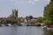 St Mary\\\'s Church of England tower overlooking the Thames with its boats and barge
