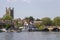 St Mary\\\'s Church of England tower overlooking the Thames with its boats and barge