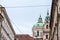 St Nicholas Church, also called Kostel Svateho Mikulase, in Prague, Czech Republic, with its iconic dome seen from nearby streets