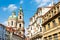 St. Nicholas Church rising up between the narrow streets. Prague