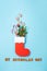 St. Nicholas Day card. Red boot with sweets, spicy ginger cookies and gifts for December 6th on blue background