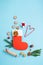 St. Nicholas Day card. Red boot with sweets, spicy ginger cookies and gifts for December 6th on blue background