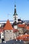 St Olaf`s church with spire and red roofs of medieval Old Town. Beautiful architecture of the Vanalinn, subdistrict in district o