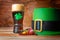 St.Patrick concept with green leprechaun hat, beer and gold