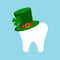 St Patrick day tooth in green leprechaun hat with clover.