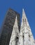 St. Patrick\'s Cathedral contrasts with a modern skyscraper