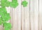 St. Patrick`s Day Background with Green Shamrocks Left top Corner on Wooden Texture