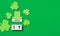 St. Patrick\\\'s Day background. Wooden calendar with shamrocks and leprechaun hat on green background. Banner. Copy space