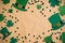 St Patrick\\\'s Day banner design. Irish leprechaun hats and shamrock clover leaves on kraft paper background with copy space.