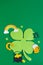 St. Patrick`s Day. Banner design with shamrock leaf, beer, hat, pot with coins and rainbow. Copy space. Vertical photo