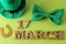 St.Patrick `s Day. celebration. A green bow tie, a leprechaun hat and a horseshoe and the text of March 17 on a bright green back