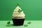 St Patrick's day concept - cupcake with shamrock topper