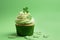 St Patrick's day concept - cupcake with shamrock topper