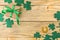 St.Patrick `s Day. Day of rest. Frame of green clover leaves on the natral wooden background. top view. space for text