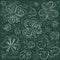 St. Patrick`s day doodle background with clover, hearts and butterflies on green chalk board