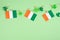 St. Patrick`s Day garlands with flag and cloverleaf decorations. Copy space