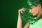 St Patrick\'s day Girl. Young woman wearing hat over green