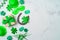 St Patrick`s day holiday background with lucky charms, shamrock and gift box. Top view, flat lay