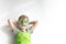 St Patrick`s Day holiday concept. Joyful caucasian boy with clover glasses on white background