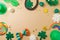 St Patrick`s day holiday frame border background with lucky charms, shamrock and  rainbow. Top view, flat lay